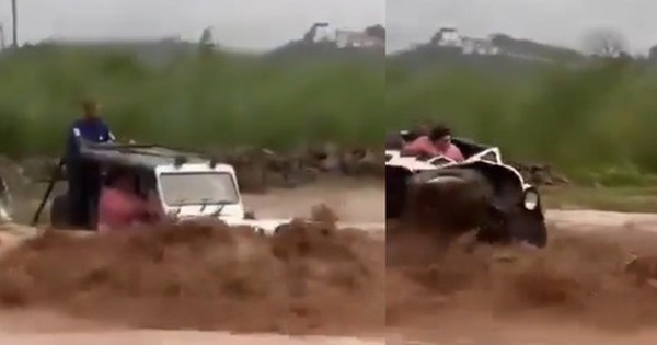 Ô tô bị nước lũ cuốn trôi, 2 người trên xe may mắn sống sót